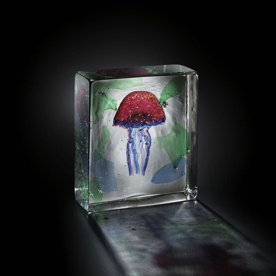 Aquarium with jellyfish, Red jellyfish inside a crystal block