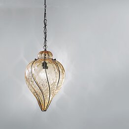Suspended lamp in submerged amber glass